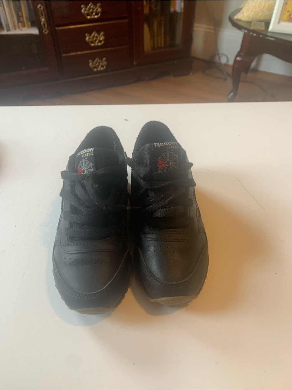 Reebok Black Leather Low-Top Sneakers with Subtle Red Logo